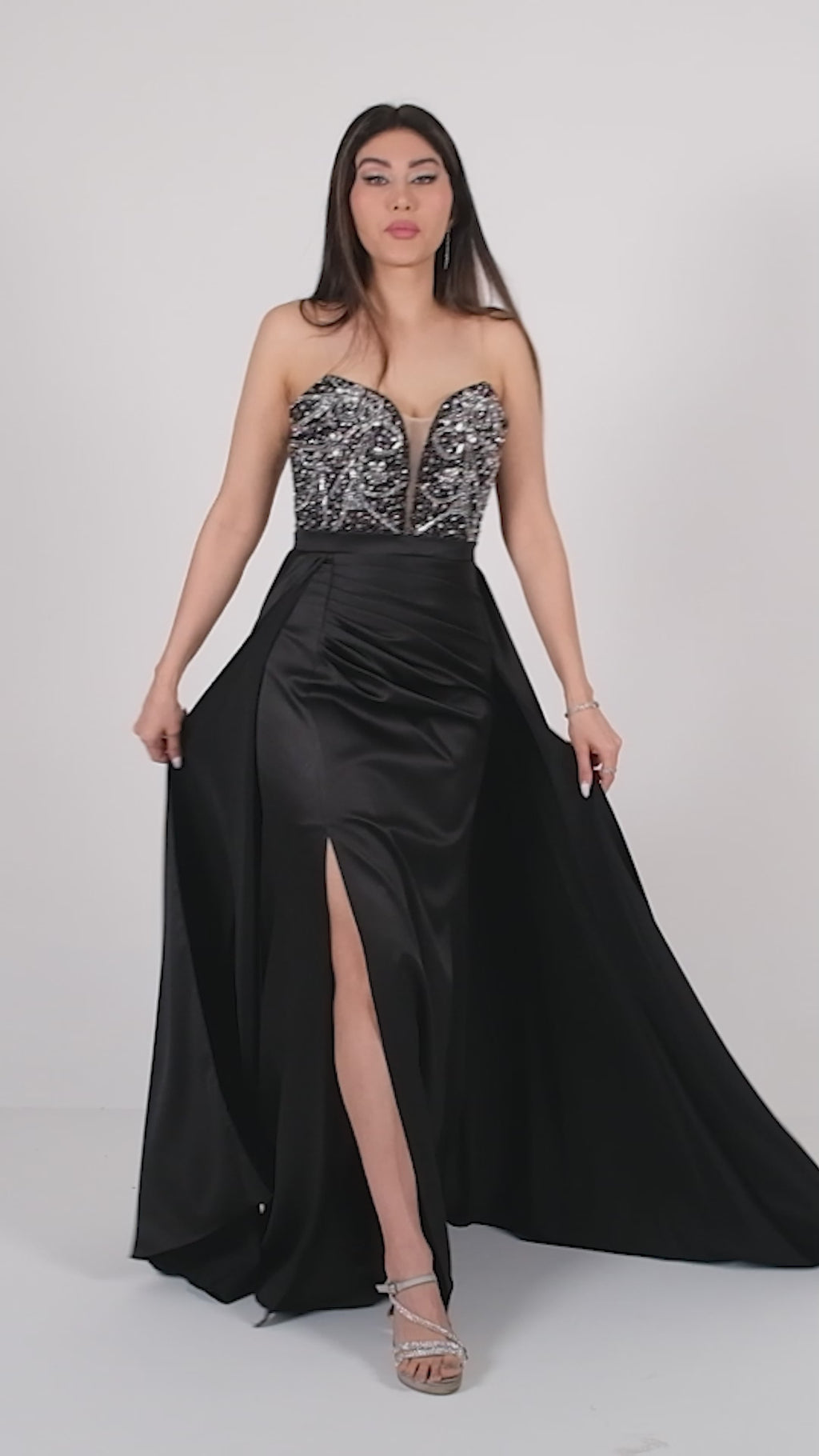 Black floor length gown with plunging neckline